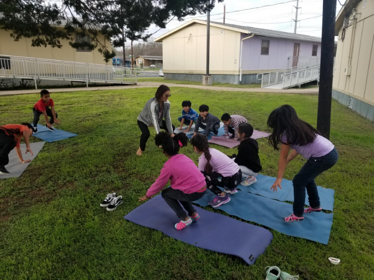 Students doing yoga in the ACE afterschool program