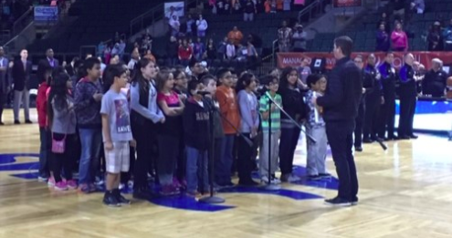 Students singing the national anthem 